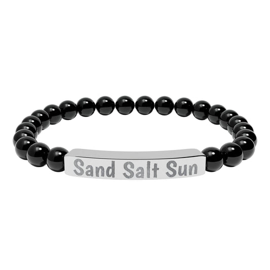 Black beaded bracelet with a silver tag reading 'Sand Salt Sun' on a white background