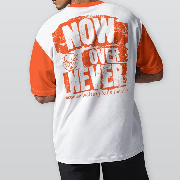 Person wearing a white and orange t-shirt with text on the back, standing against a plain background