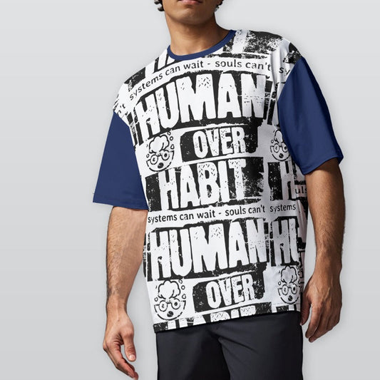 Person wearing a sleeveless shirt with 'Human Over Habit' text on a plain background