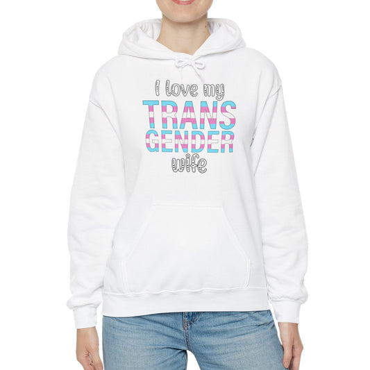 Person wearing a white hoodie with colorful text on a white background