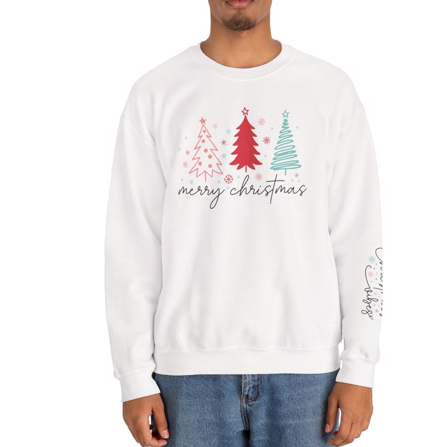 Person wearing a white sweatshirt with Christmas tree design and 'merry christmas' text on a white background