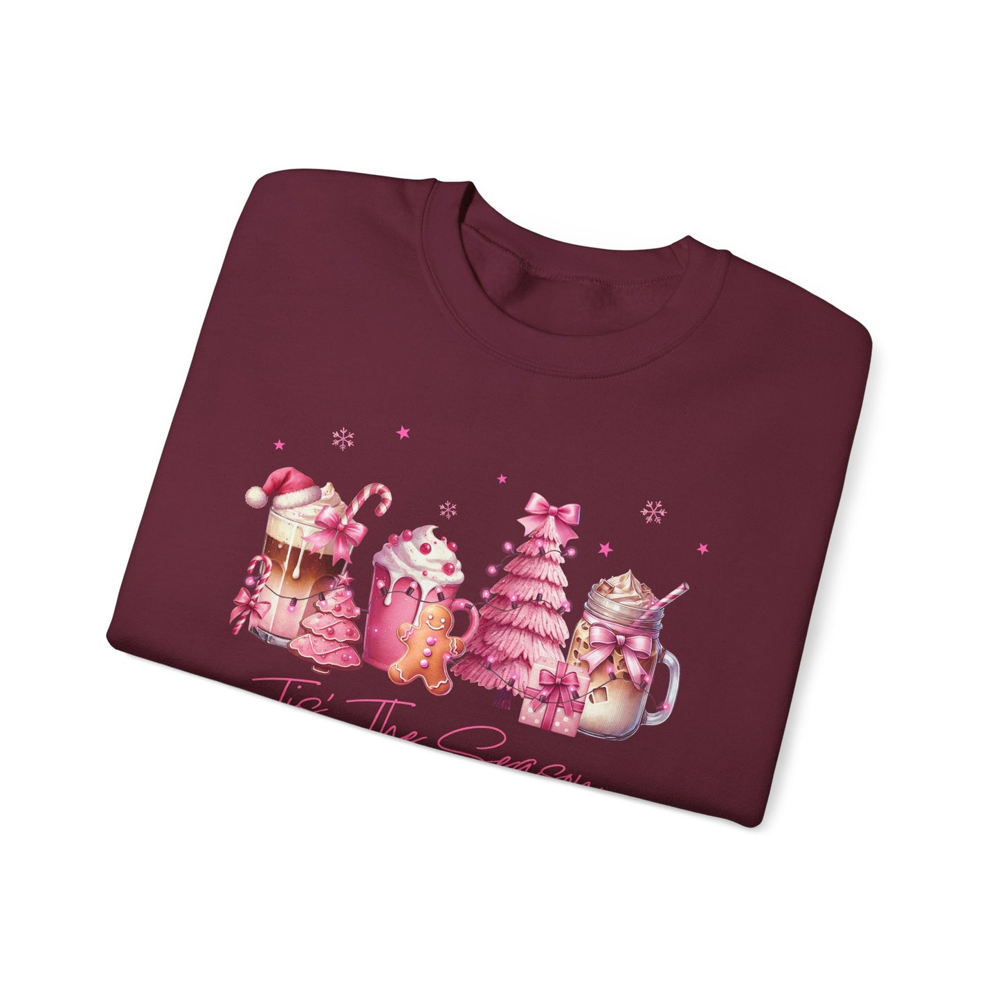 Folded maroon sweatshirt with Christmas-themed design on a white background