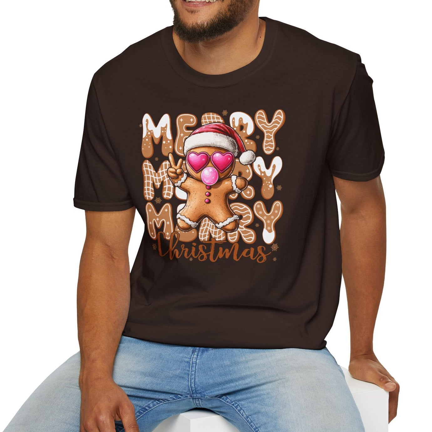Man wearing a chocolate brown t-shirt with 'Merry Christmas' gingerbread design on a white background