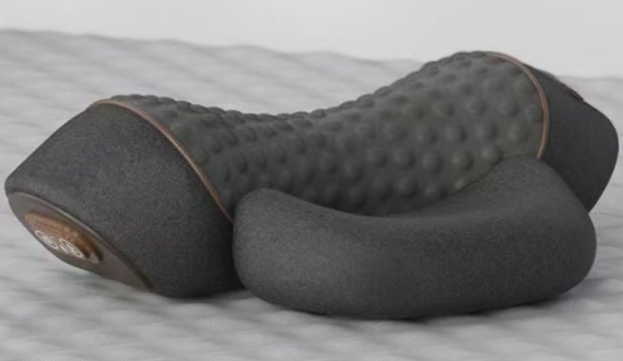 Gray foam roller with textured surface on a light gray background