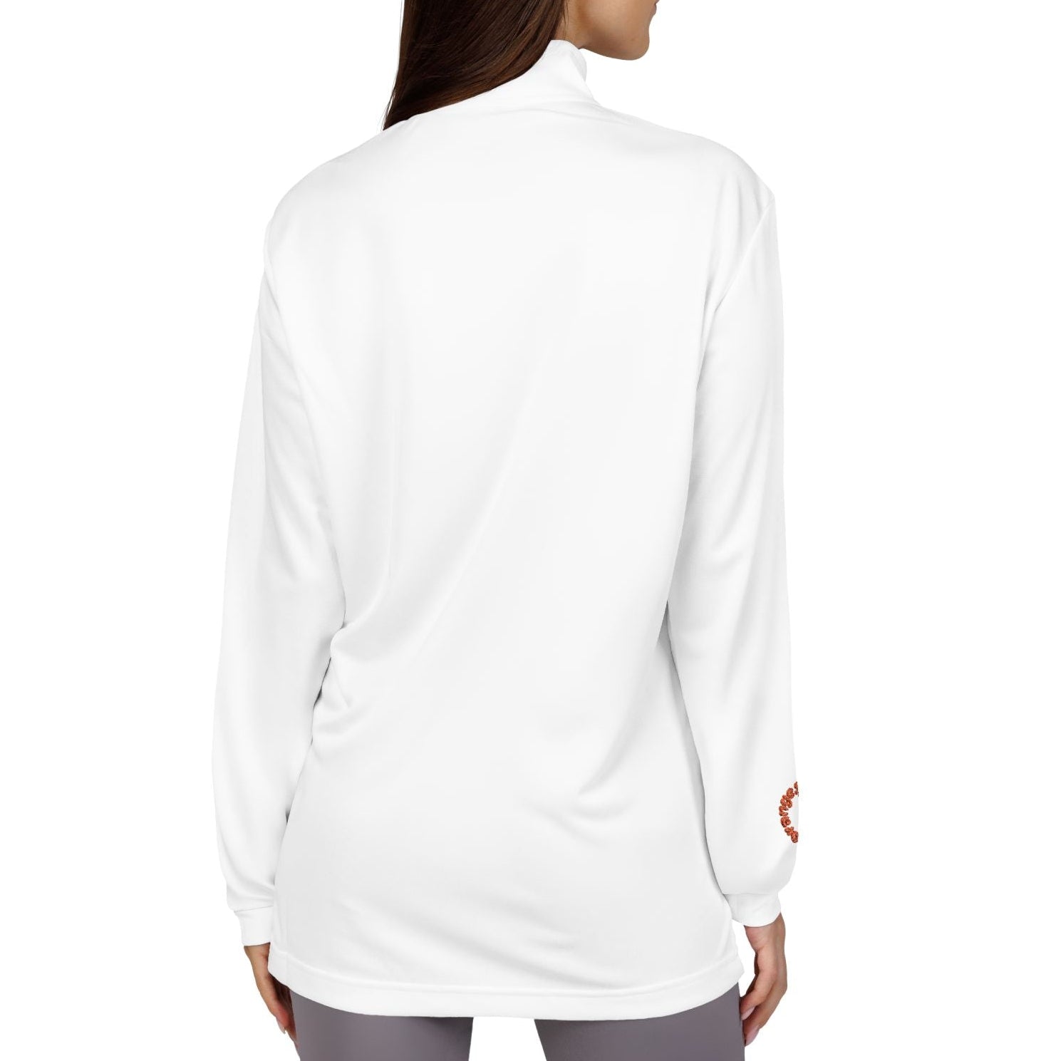 Woman wearing a white long-sleeve top on a white background
