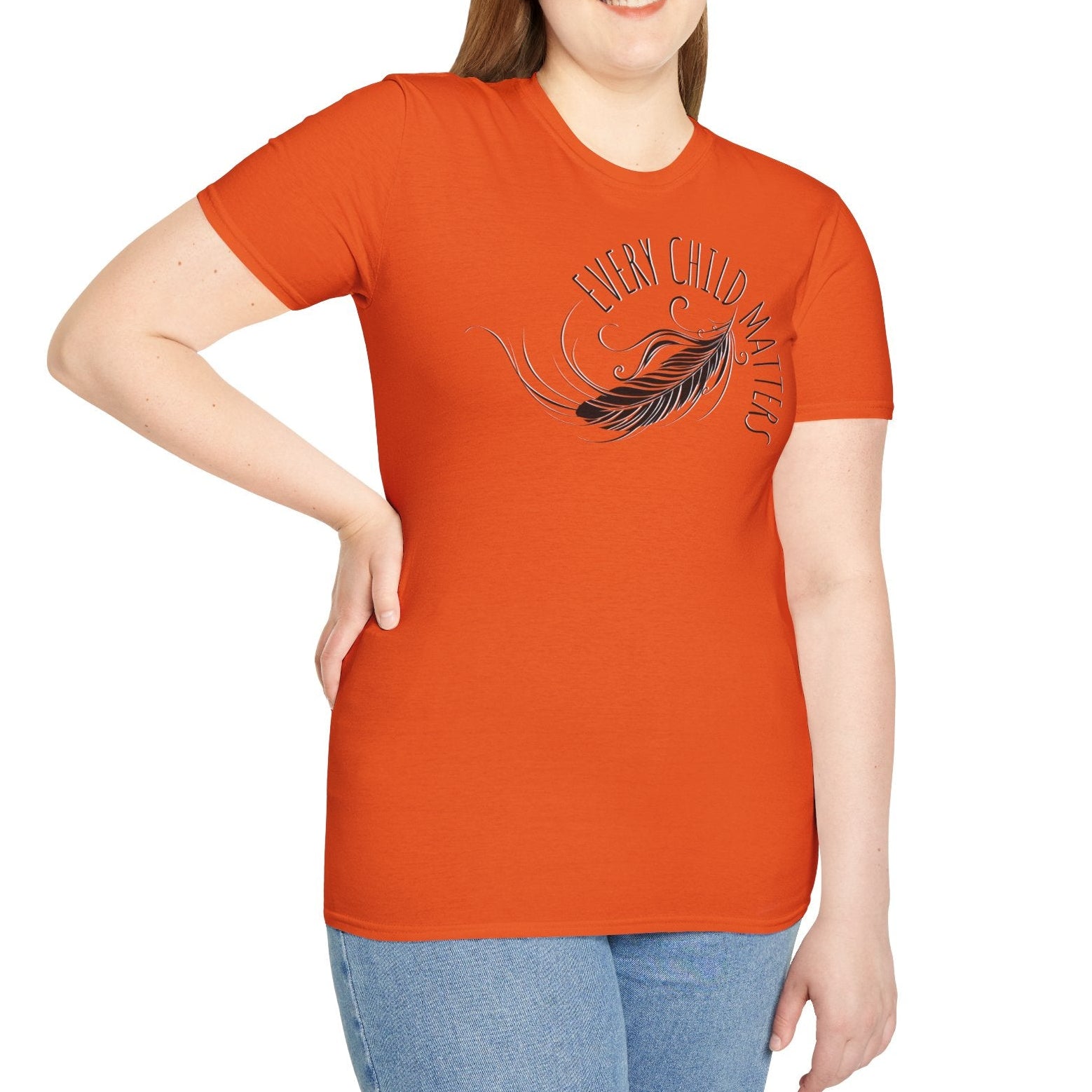 Person wearing an orange t-shirt with a graphic design on a white background