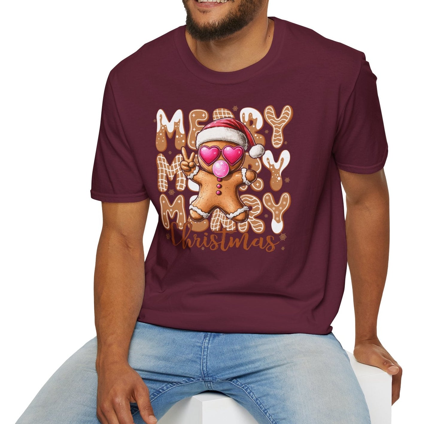 Man wearing a maroon t-shirt with 'Merry Christmas' design on a white background