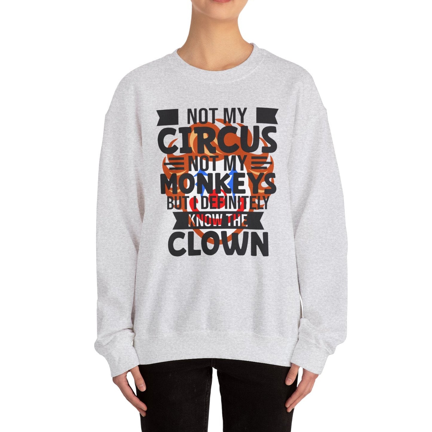 Person wearing a gray sweatshirt with a humorous text design on a white background