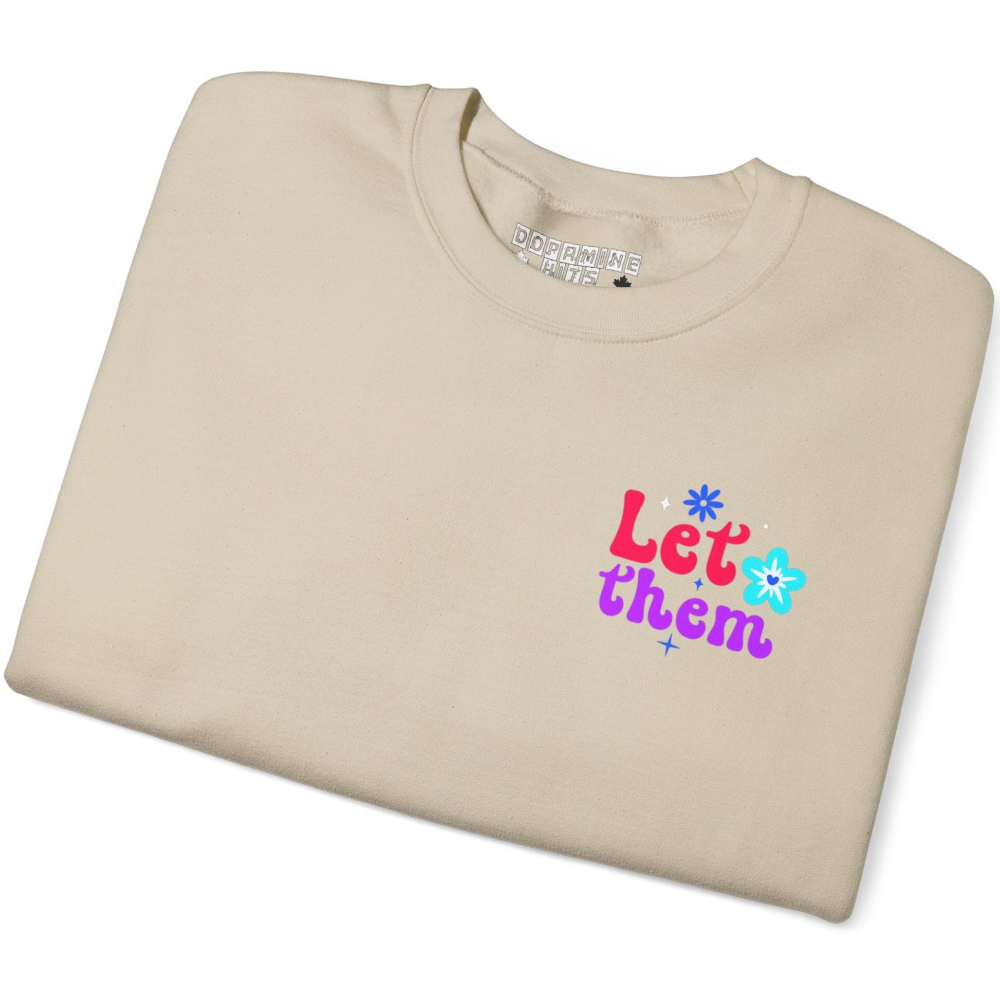 Sand t-shirt with colorful text and flower graphics on a white background