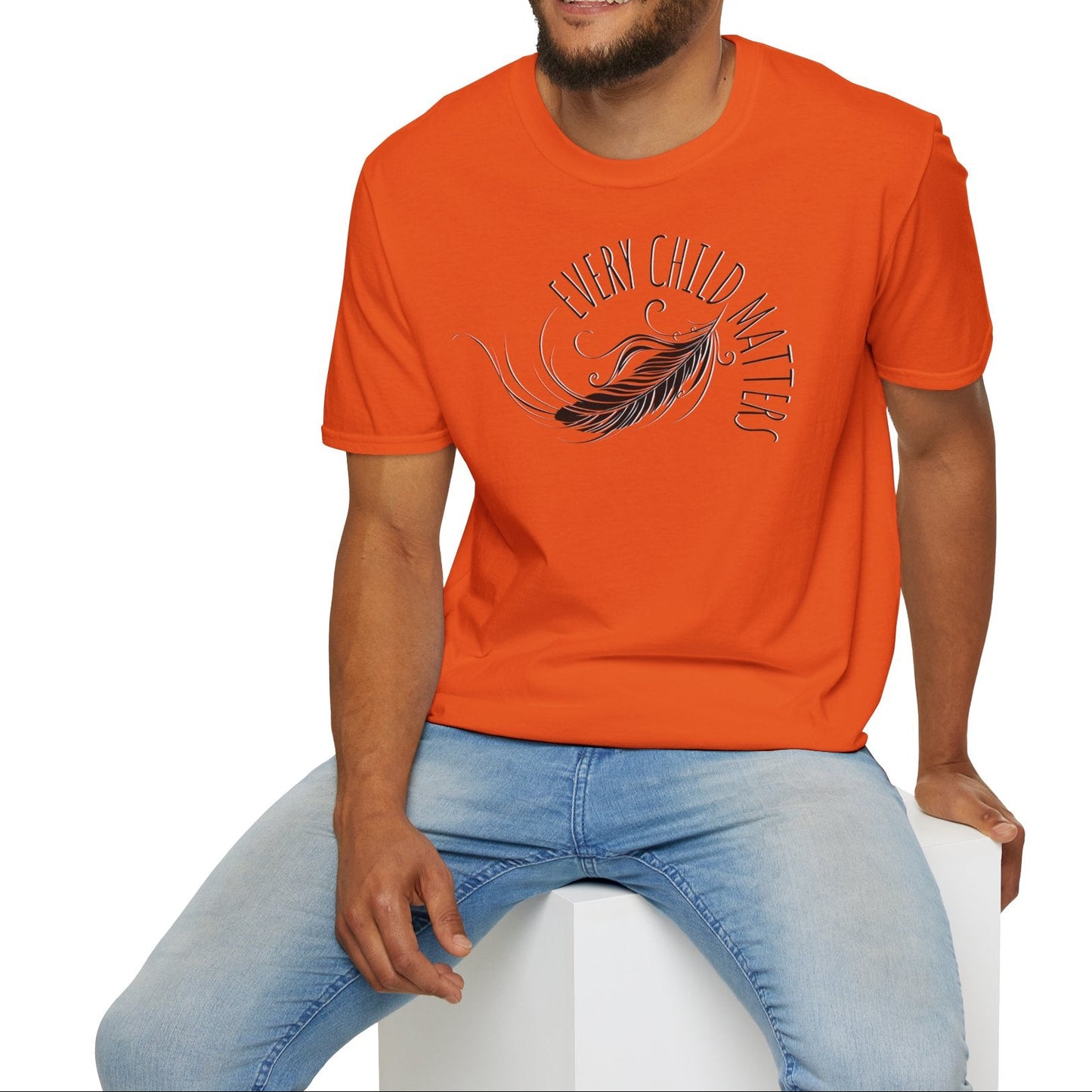 Man wearing an orange t-shirt with a graphic design on a white background