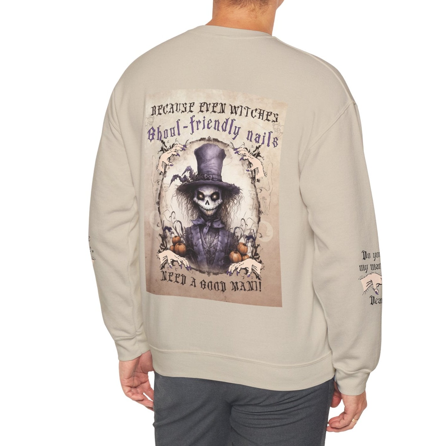 Person wearing a beige sweatshirt with a graphic design on the back, featuring a skeleton in a top hat and text.