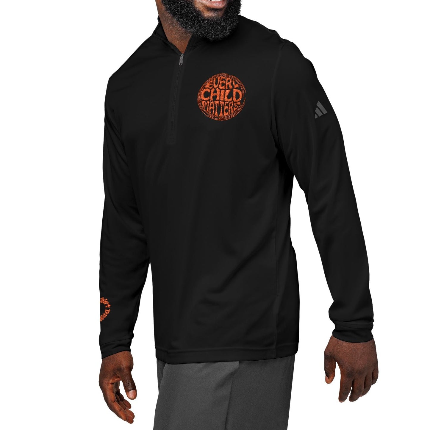 Man wearing a black long-sleeve shirt with a logo on a white background