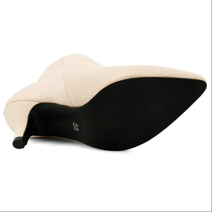 Beige and black shoe on a white background