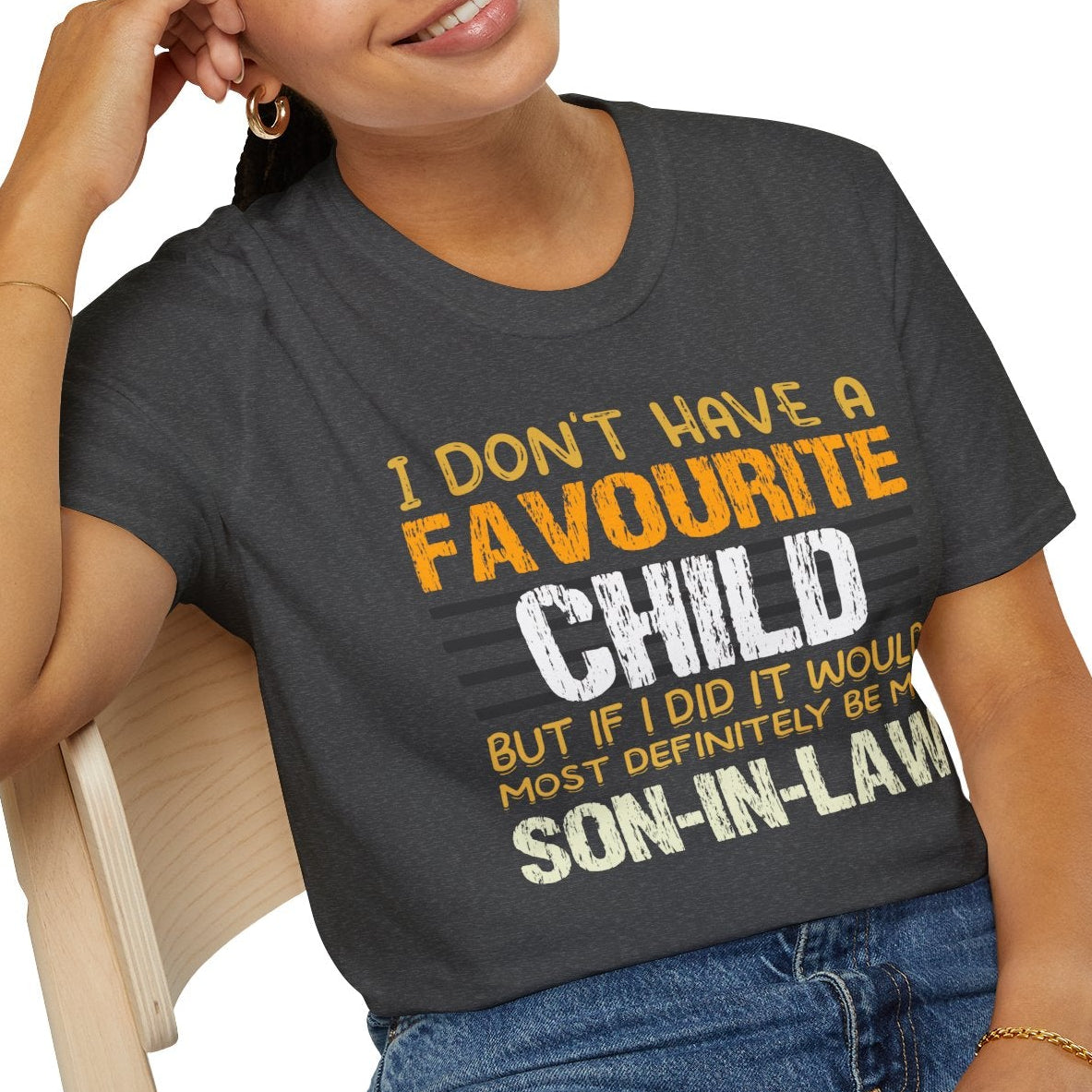 Person wearing a dark heather t-shirt with humorous text design on a white background