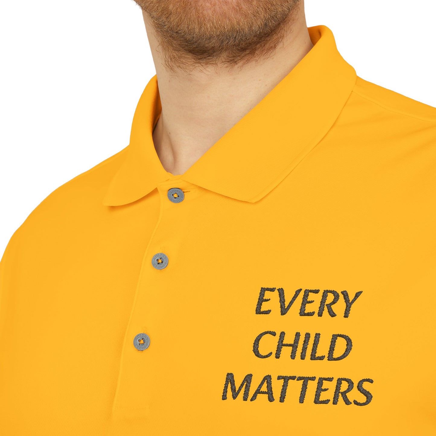 Close-up of a man wearing a bright yellow polo shirt with the text 'EVERY CHILD MATTERS' embroidered in black on the chest, on a white background.