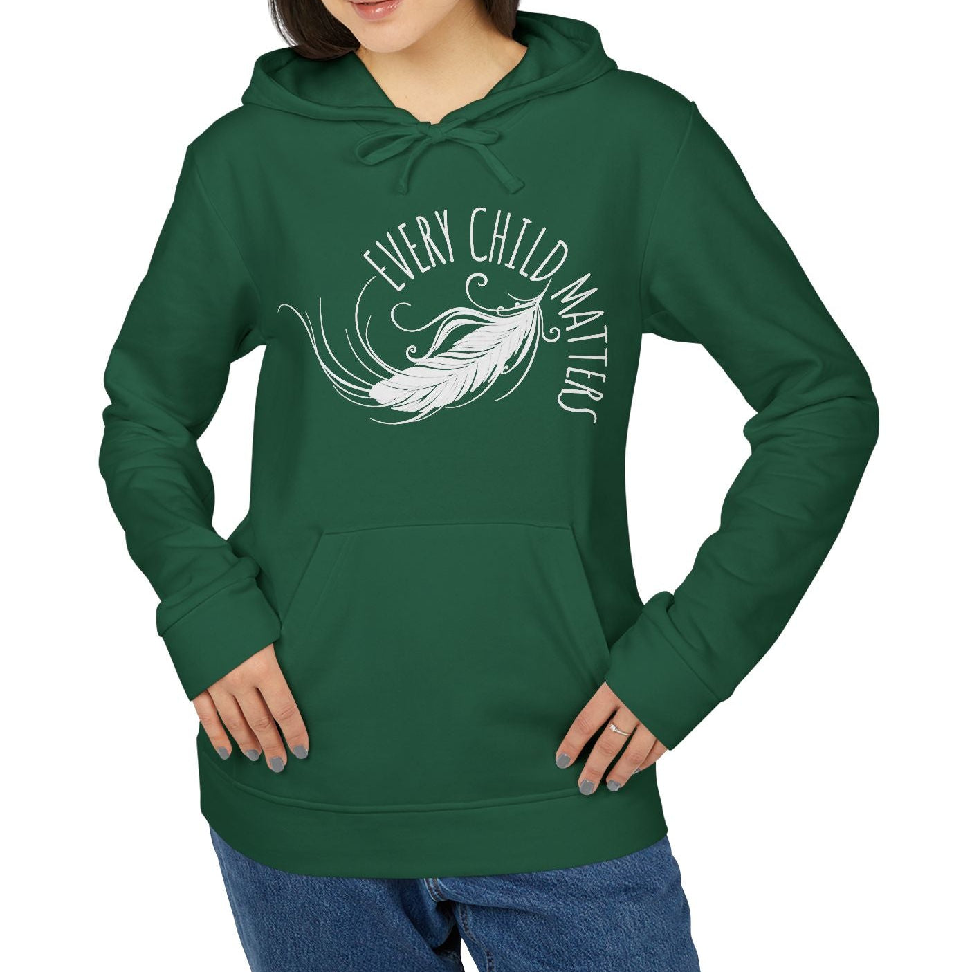 Person wearing a green hoodie with 'Every Child Matters' text and feather design on a white background