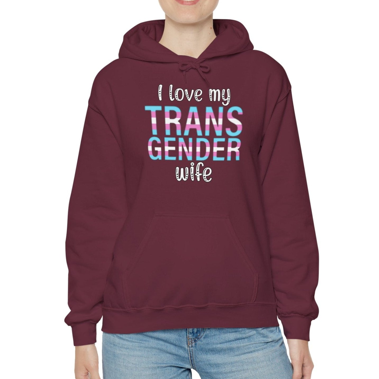 Person wearing a maroon hoodie with 'I love my TRANS GENDER wife' text on a white background