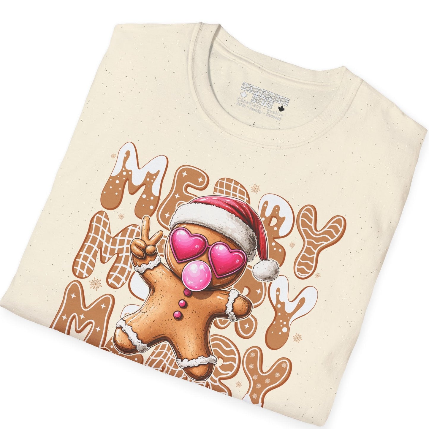 Folded cream-colored t-shirt with a gingerbread man design and text on a white background