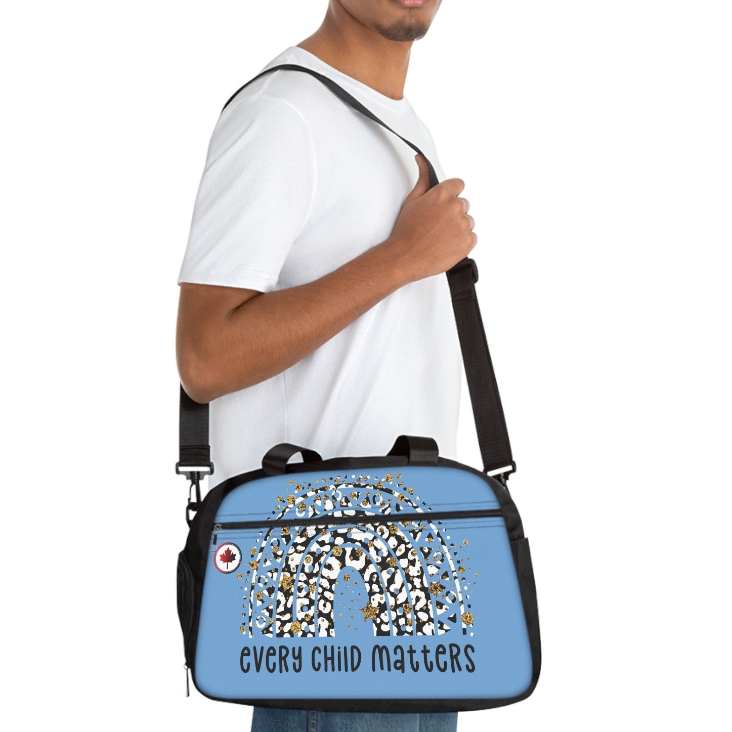 Person carrying a blue bag with 'Every Child Matters' text and design.