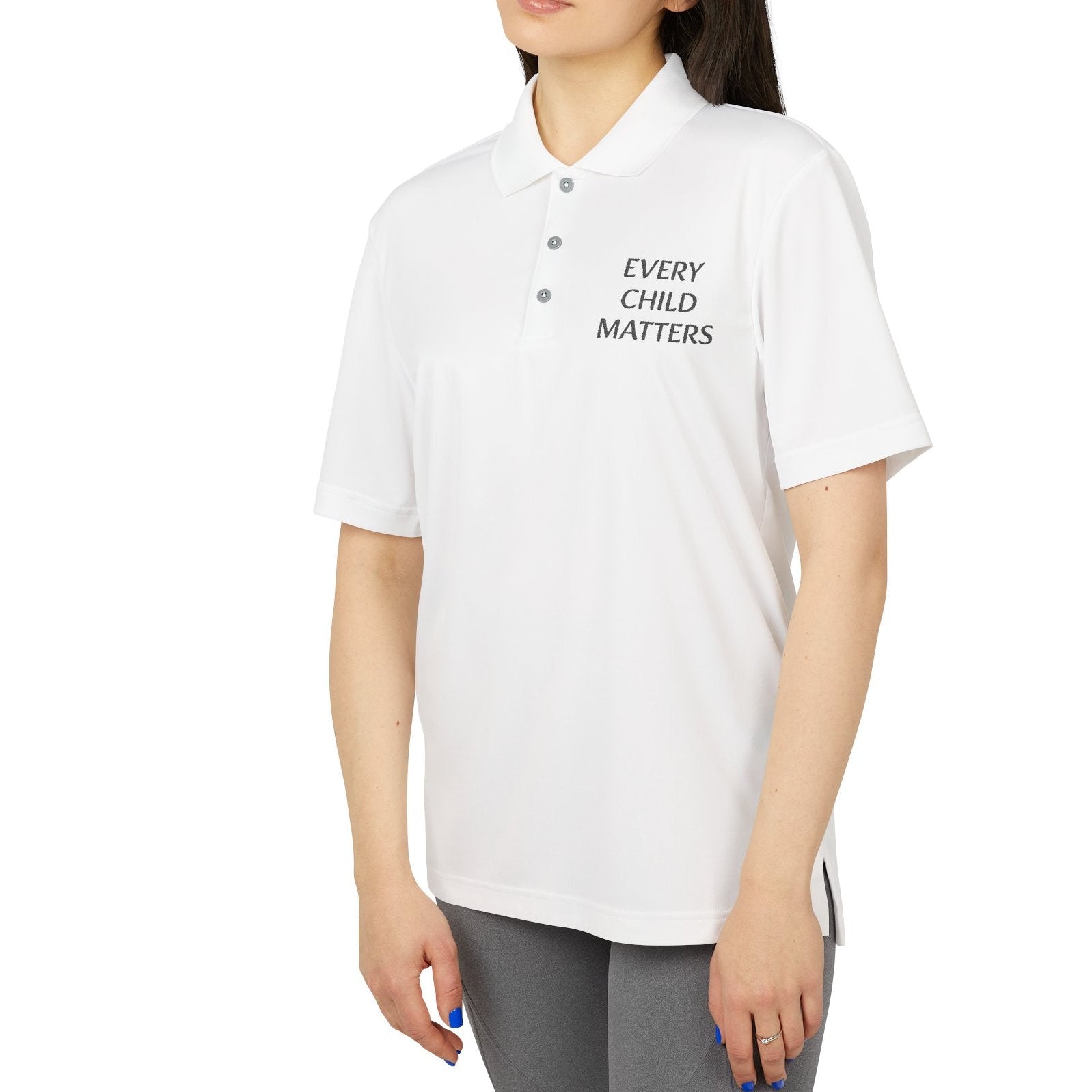 Woman wearing a white polo shirt with 'Every Child Matters' text on a white background