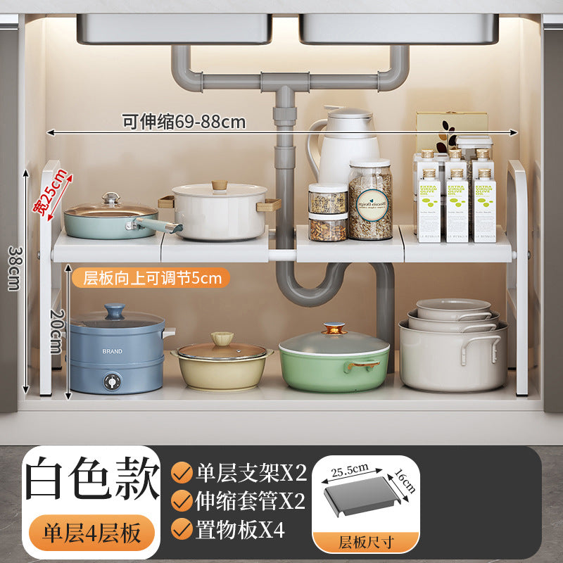 Under-sink kitchen storage shelf with pots, pans, and bottles on a neutral background