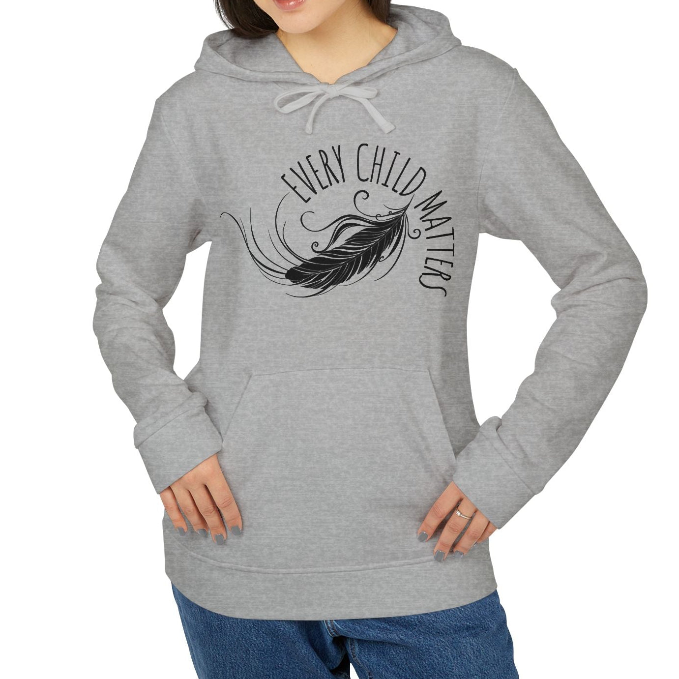 Person wearing a gray hoodie with a feather design and text on a white background