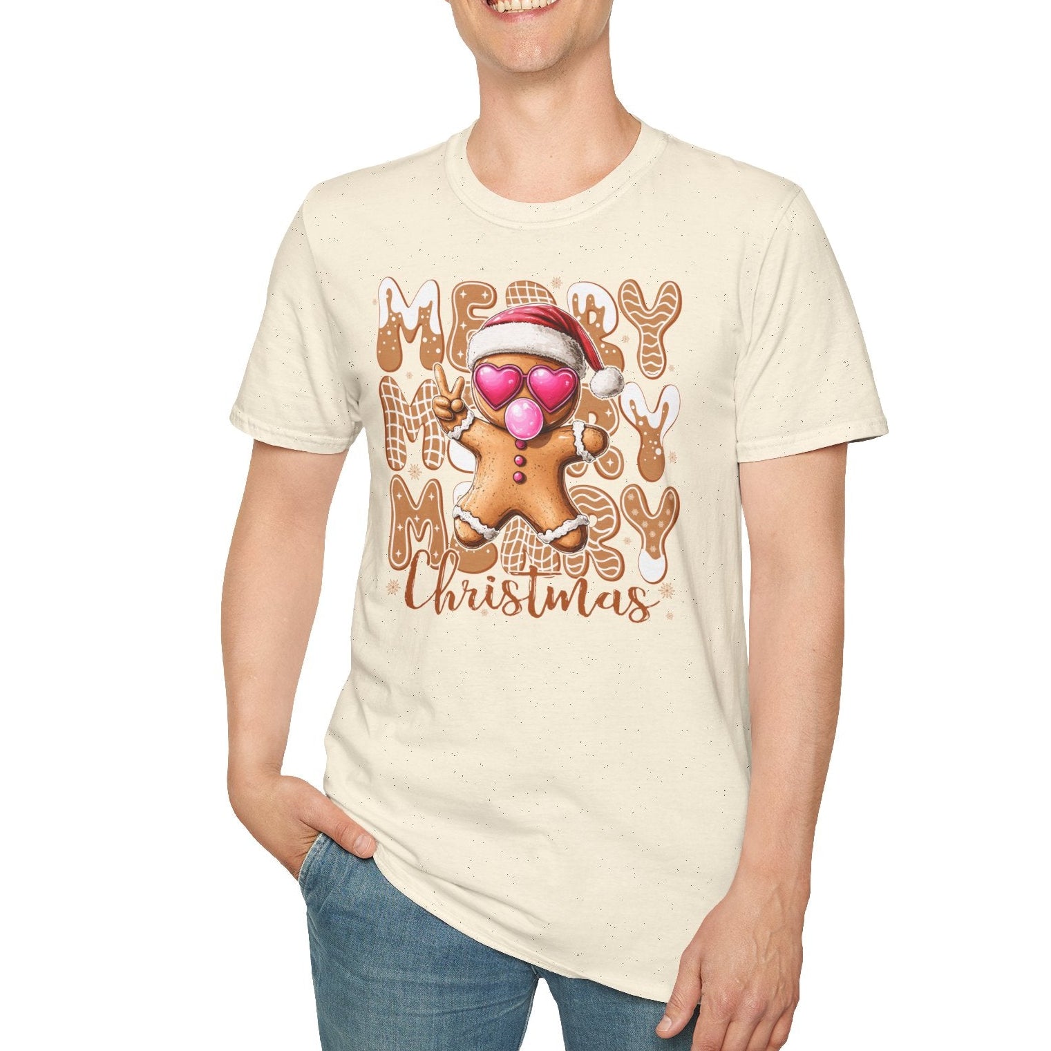Person wearing a cream t-shirt with a gingerbread man design and 'Merry Ho Ho Ho Christmas' text on a white background