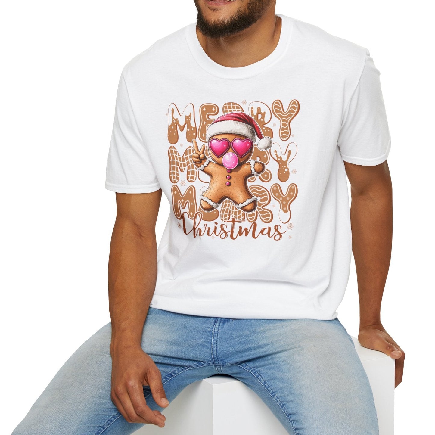 Man wearing a white t-shirt with a gingerbread man design and 'Merry Christmas' text on a white background