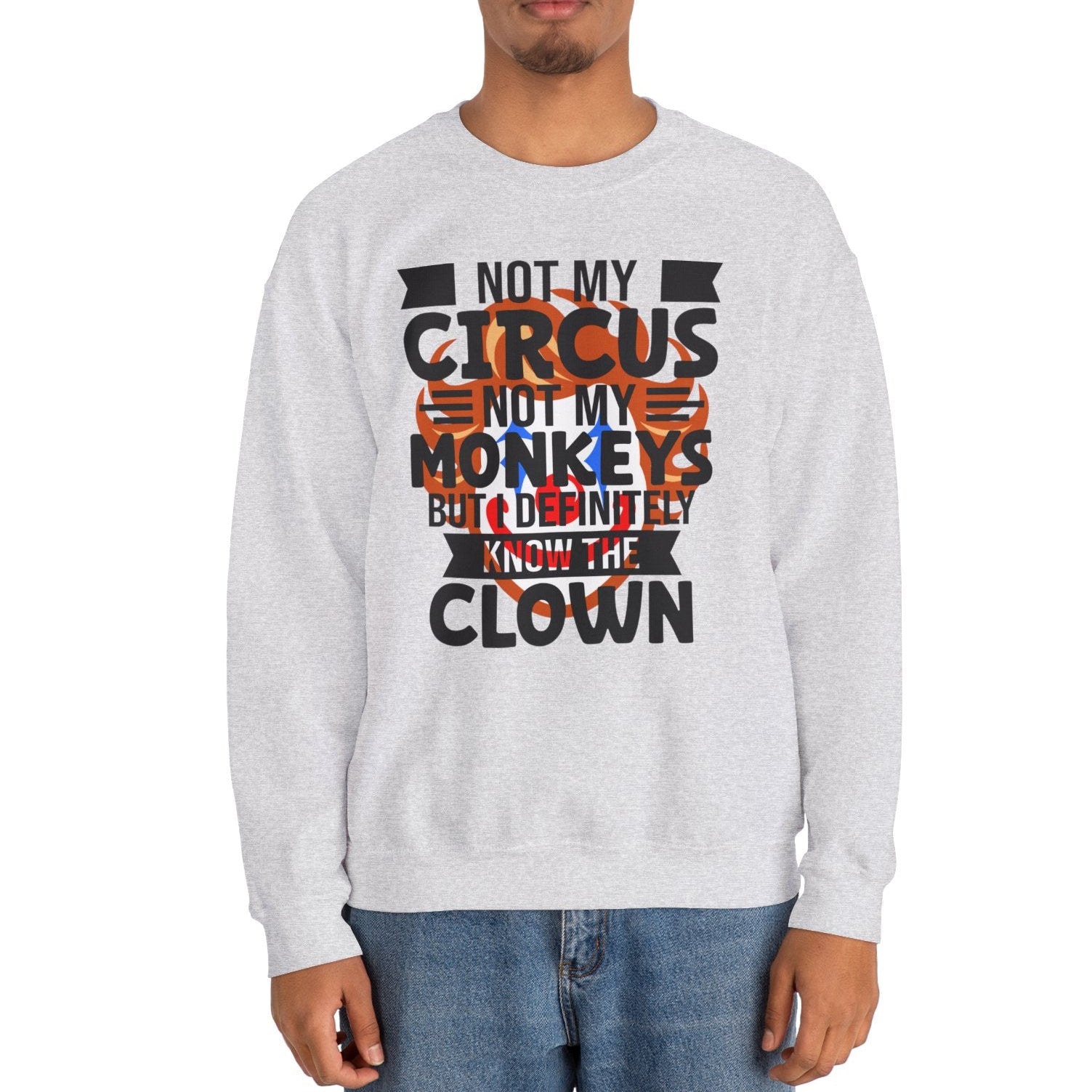 Person wearing a gray sweatshirt with a humorous text design on a white background