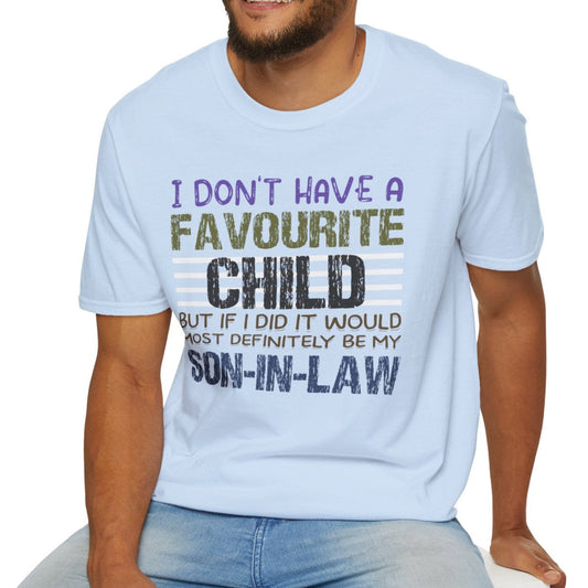 Man wearing a light blue t-shirt with humorous text design, sitting on a white stool against a white background.