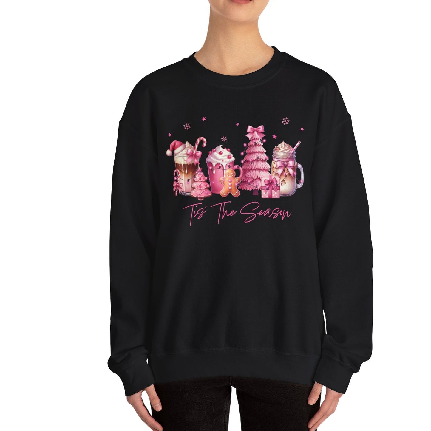 Person wearing a black sweatshirt with festive graphics and text on a white background