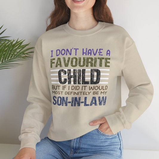 Woman wearing a bone sweatshirt with humorous text, sitting on a white surface with a plant in the background.