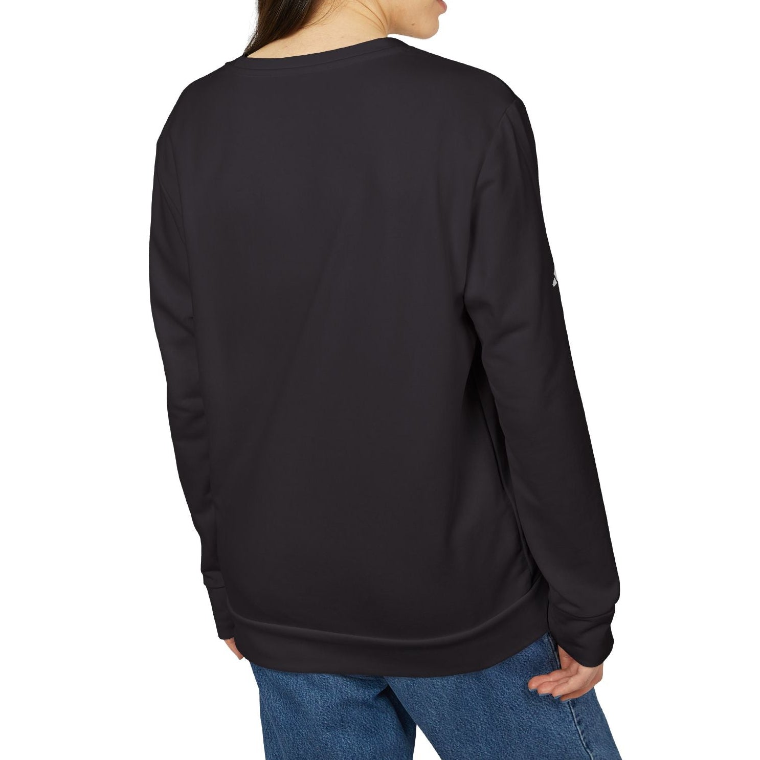 Person wearing a black sweatshirt and blue jeans on a white background