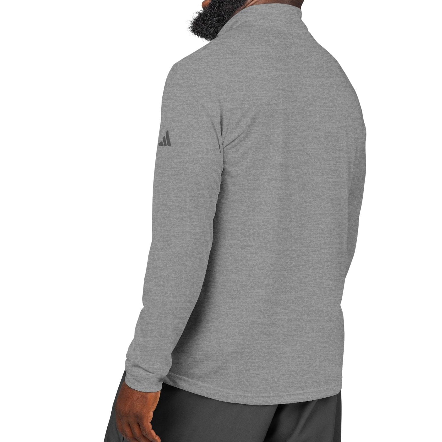 Man wearing a gray Adidas long-sleeve shirt on a white background