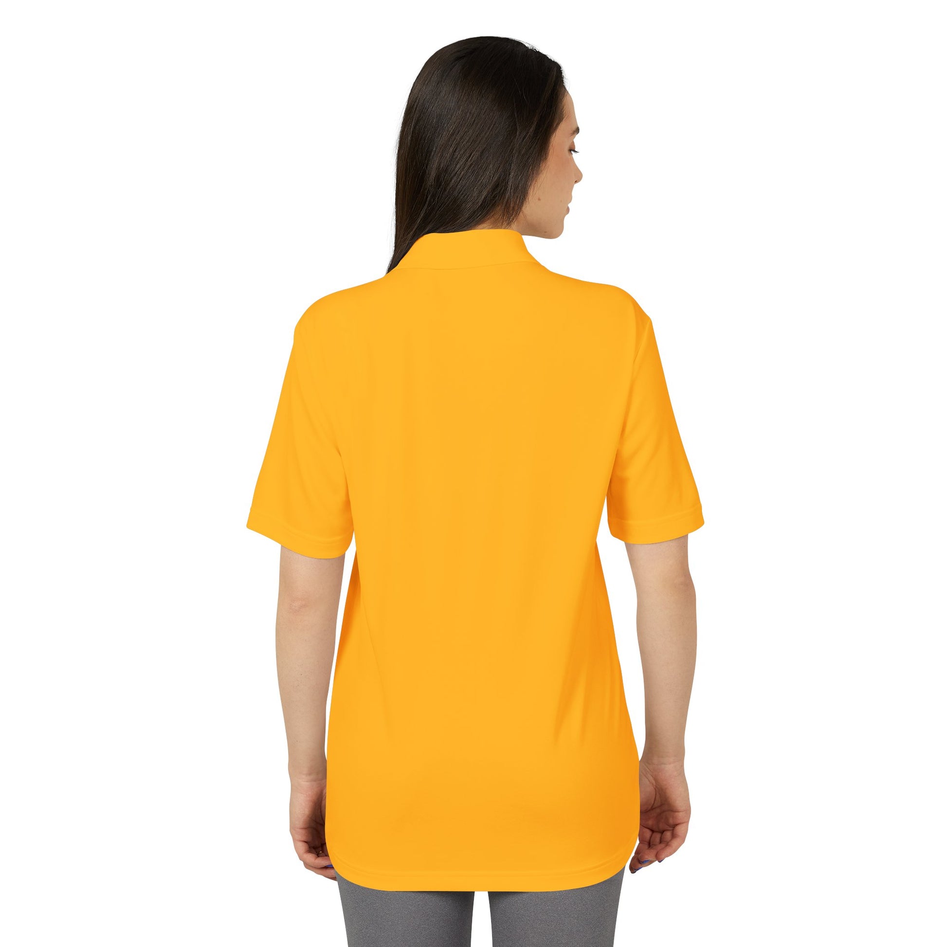 Woman wearing a yellow polo shirt on a white background