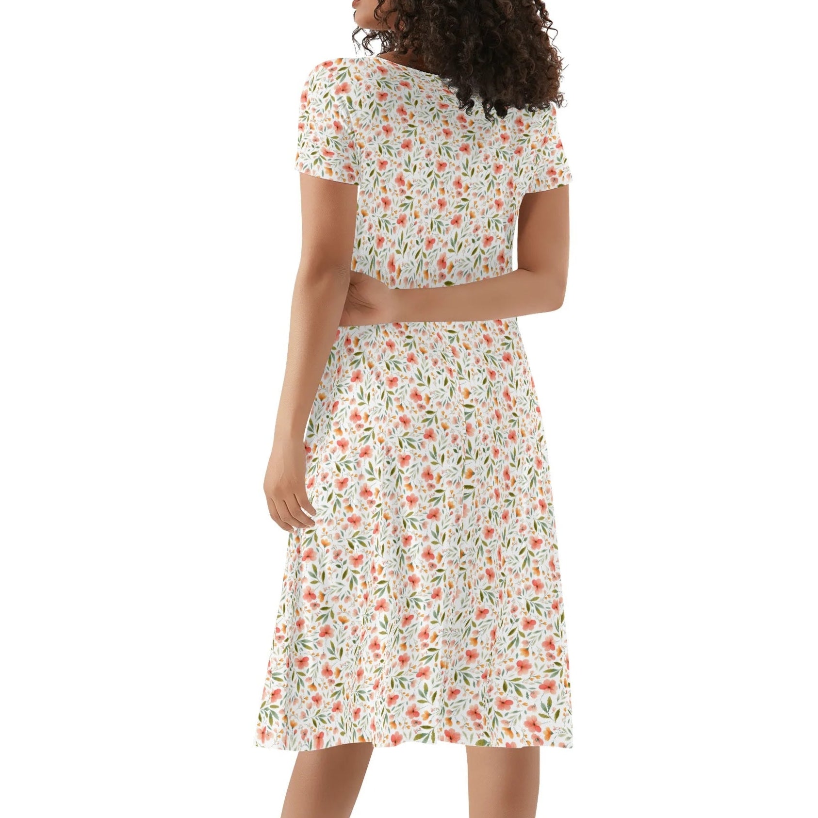 Woman wearing a floral dress on a white background