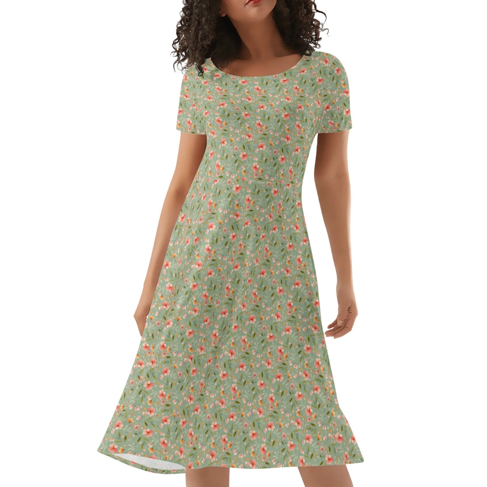 Woman wearing a green floral dress on a white background