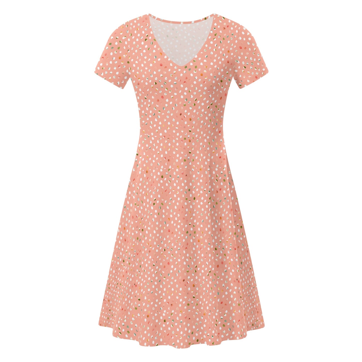Peach dress with white polka dots on a white background