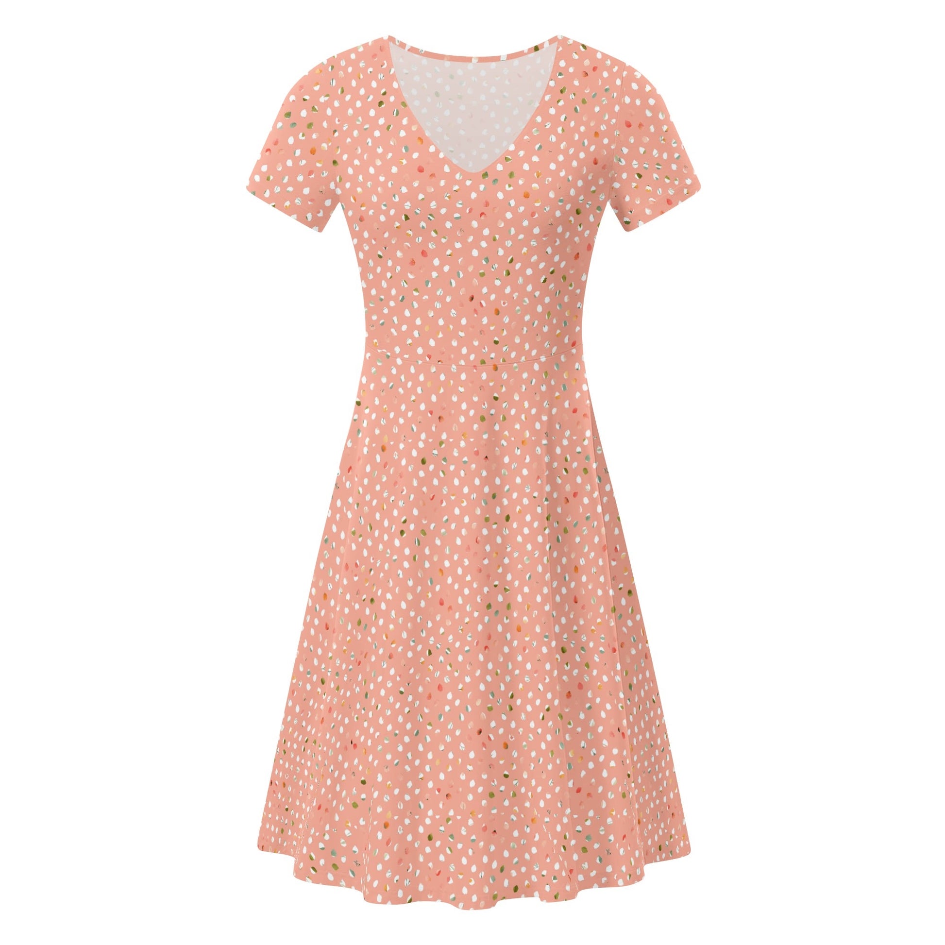 Peach dress with white polka dots on a white background