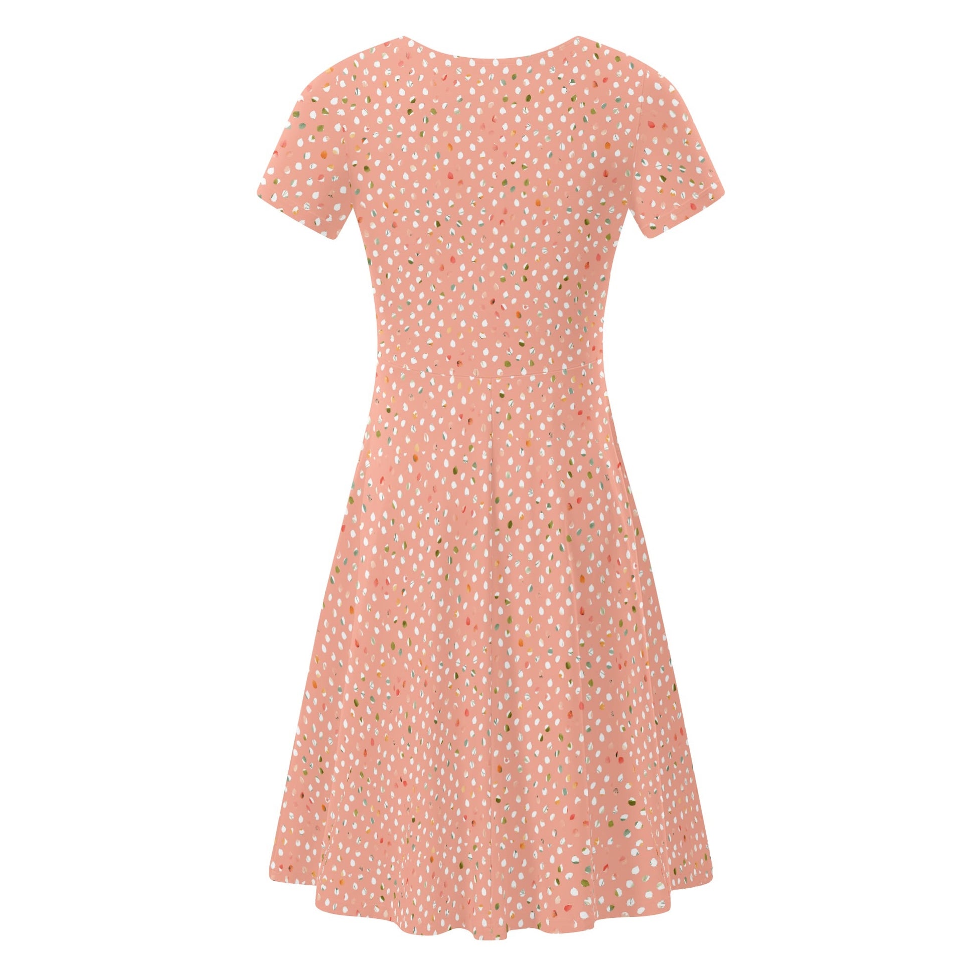 Peach dress with white polka dots on a white background