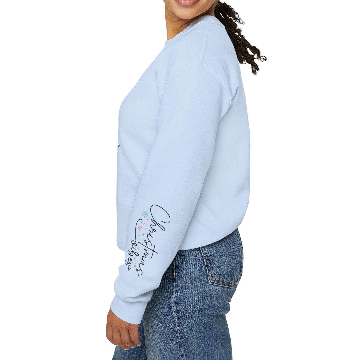 Woman wearing a light blue sweatshirt with text on the sleeve against a white background