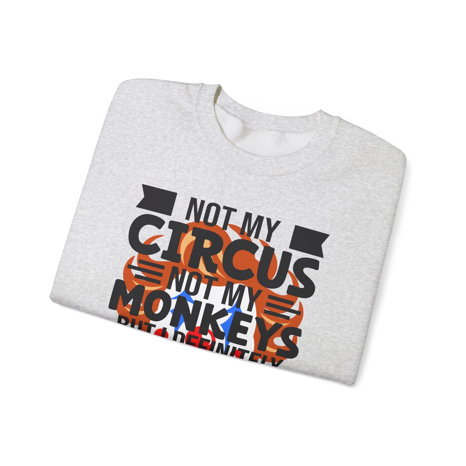 Folded gray sweatshirt with 'Not My Circus Not My Monkeys' text on a white background