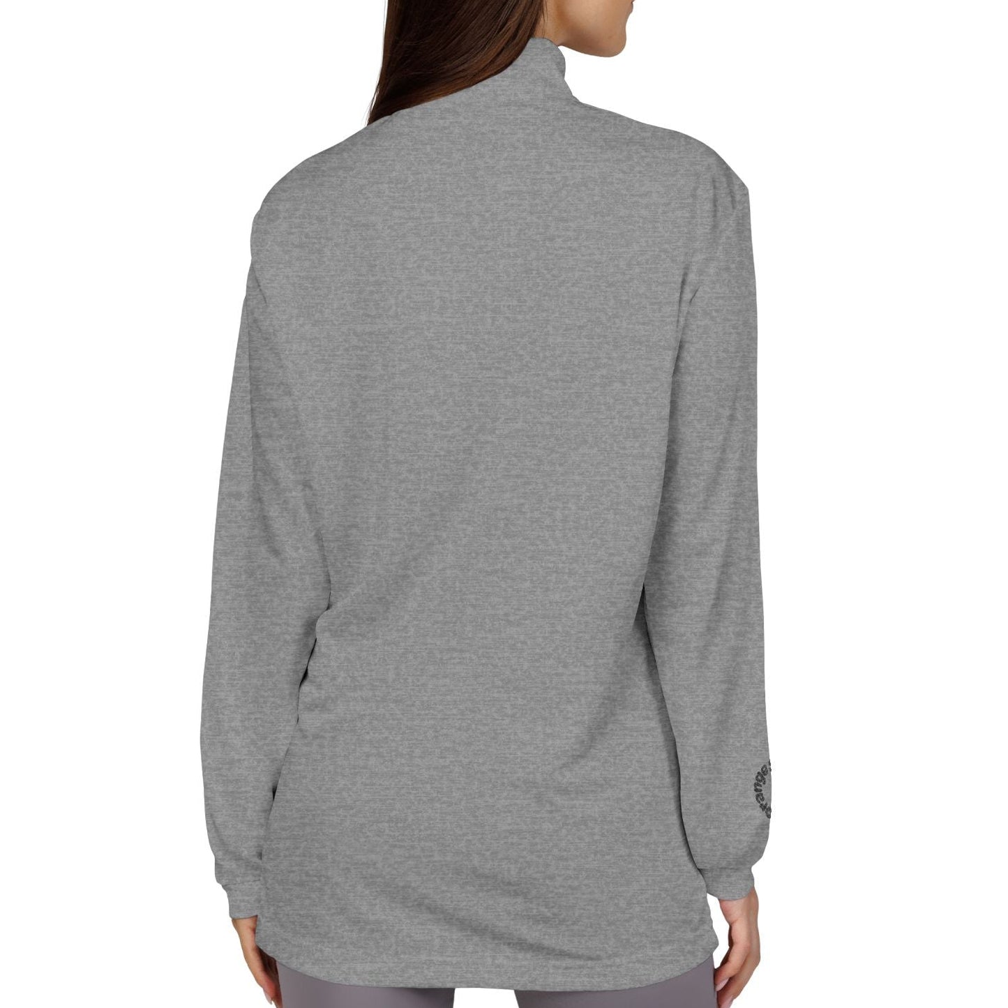 Woman wearing a gray long-sleeve top on a white background