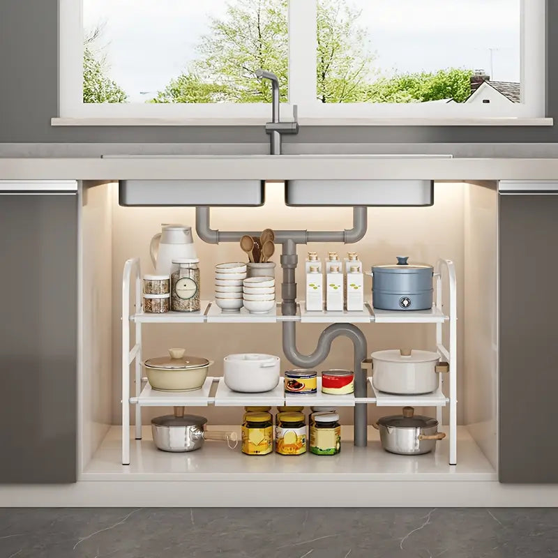 Under-sink kitchen storage rack with various kitchen items.