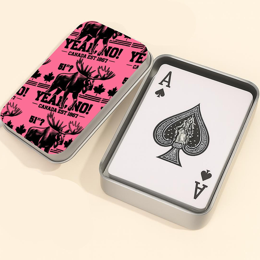 Playing cards with a pink and black design and a white card showing an Ace of Spades, next to a dice on a light background.