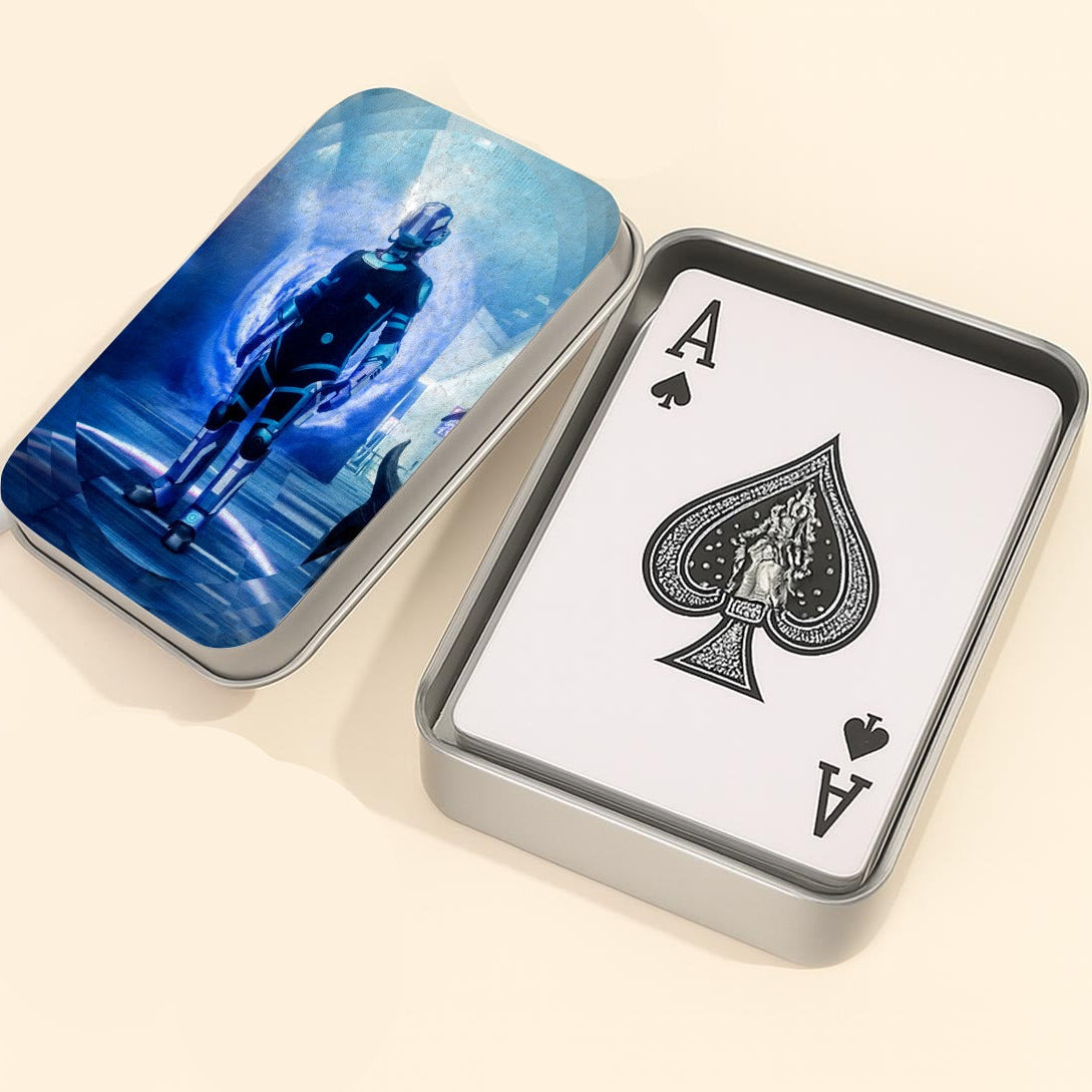 Playing card with Ace of Spades and a tin case on a light background