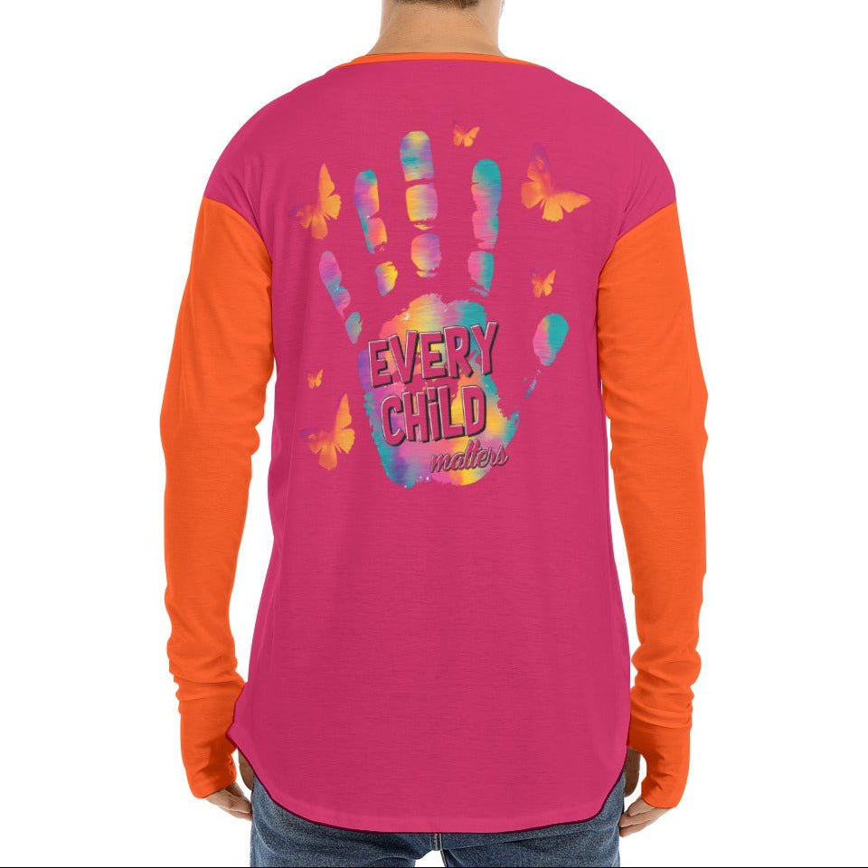 Person wearing a pink and orange shirt with colorful handprints and butterflies on the back.