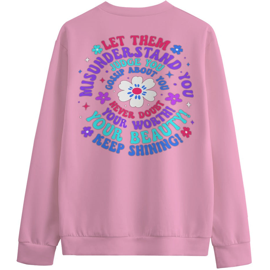 Pink sweatshirt with motivational quote and flower design on a white background