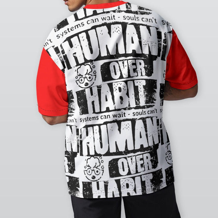 Person wearing a shirt with 'Human Over Habit' text on a plain background