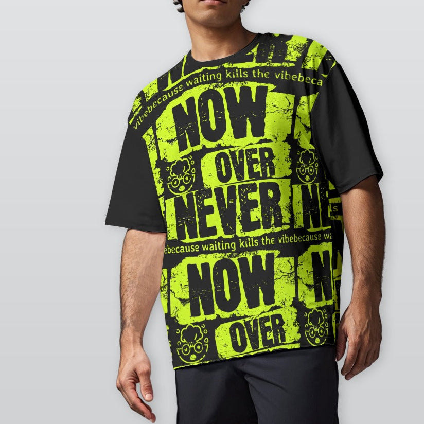 Person wearing a black and yellow graphic t-shirt with text on a plain background